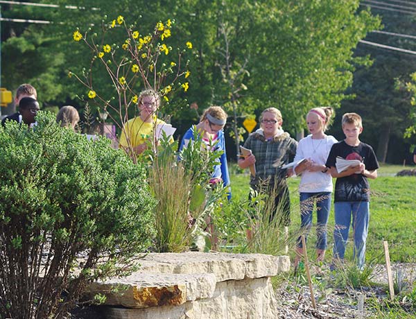 Students-at-Aldo-Leopold-Middle-School-Prairie-classroom,-learning-the-difference-betweeen-prairie-dock-and-compass-plant..jpg